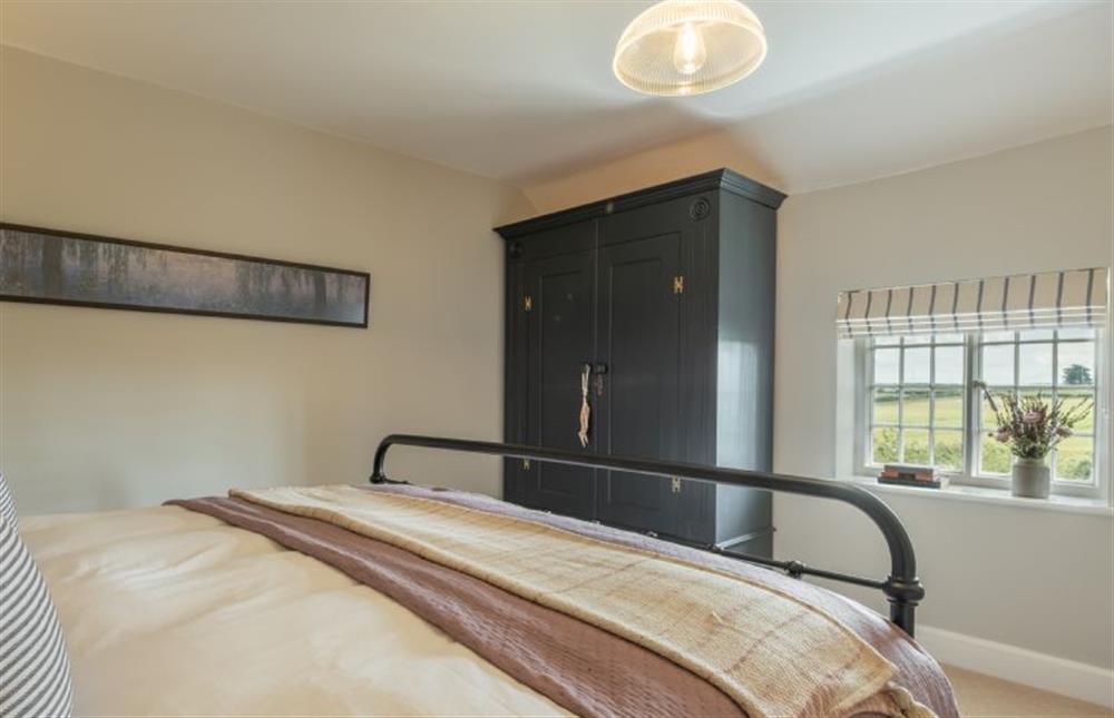 First floor:  Admire the countryside views from the super-king size bed at Holkham Skies, Wells-next-the-Sea