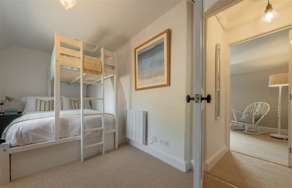 First floor: Bedroom two has a double and single bunk at Holkham Skies, Wells-next-the-Sea