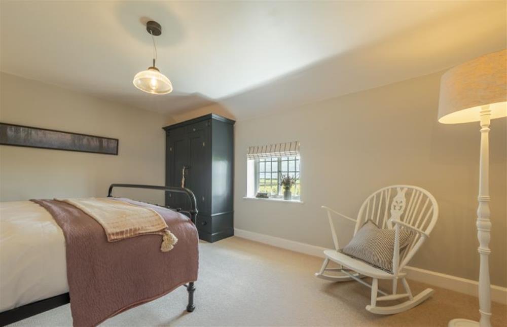 First floor: Simple yet stylish master bedroom at Holkham Skies, Wells-next-the-Sea