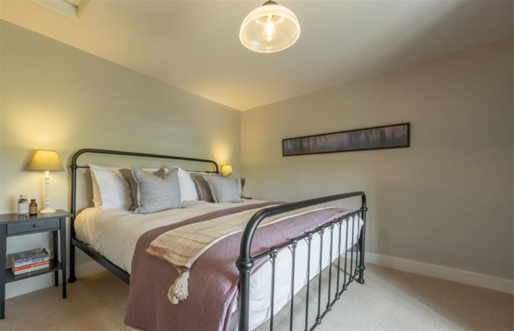 First floor: Super-king sized bed in the master bedroom at Holkham Skies, Wells-next-the-Sea
