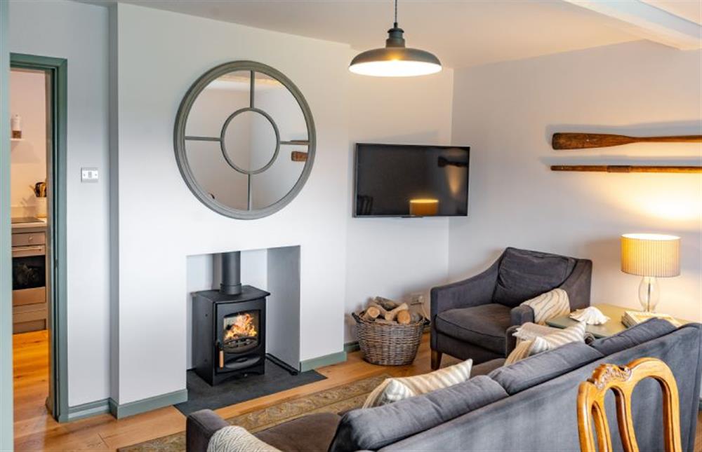 Ground floor: Bright and peaceful living area with wood burning stove at Holkham Skies, Wells-next-the-Sea