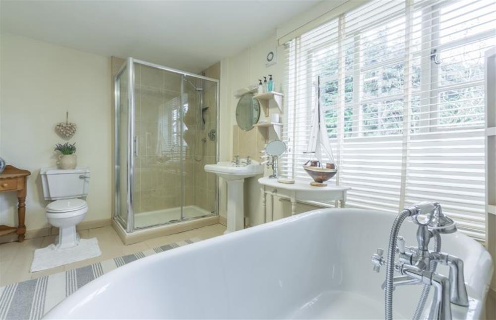 First floor: Master bedroom en-suite bathroom with separate shower room at Holland House, Docking near Kings Lynn