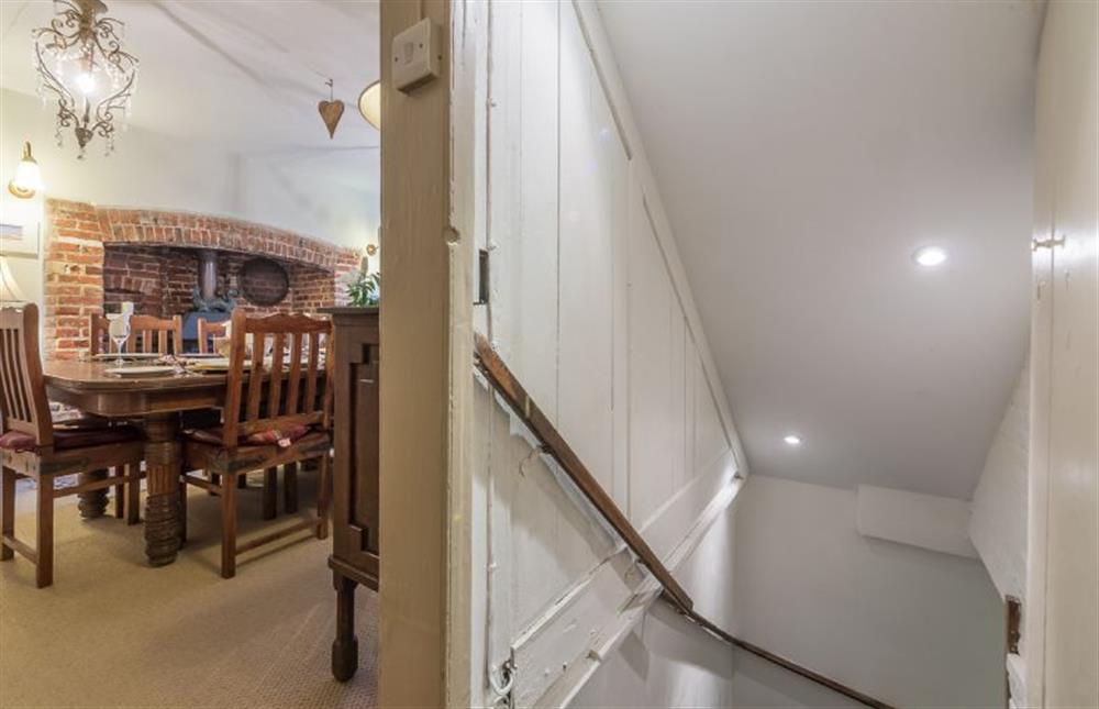 Ground floor: Stairs lead to the basement and Games room at Holland House, Docking near Kings Lynn
