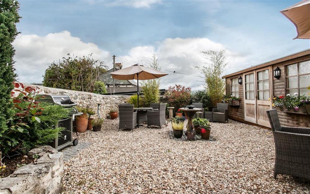 Garden furniture and barbecue provided for guests at Hollie Cottage in Seaton