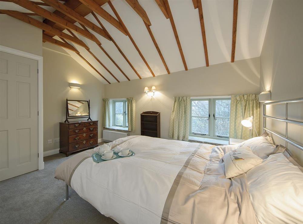 Large beamed double bedroom (photo 2) at Holliers Cottage in Middle Barton, near Chipping Norton, Oxfordshire