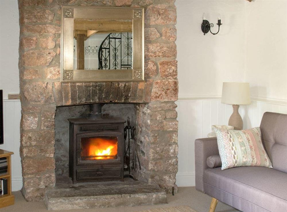 Comfy living room with cosy wood burner at Hollies Cottage in Draycott, near Cheddar, Somerset
