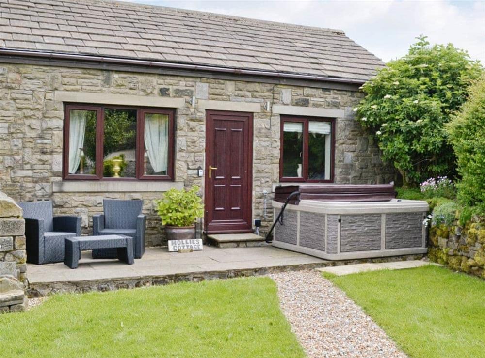 Exterior featuring private hot tub at Hollies Cottage in Keighley, West Yorkshire