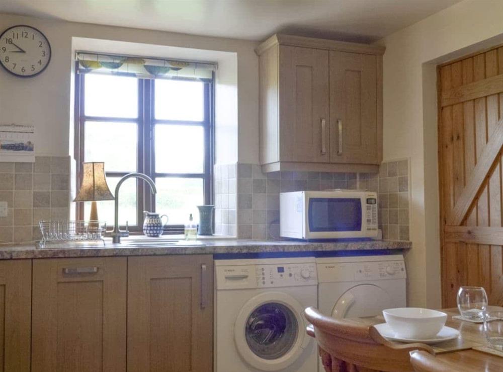 Well-equipped kitchen with dining area at Holly Bank in Crich, Derbyshire