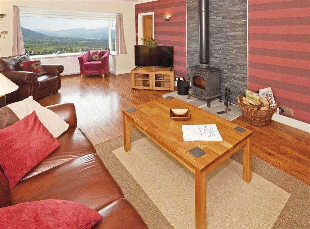 Spacious lounge with wood burning stove at Holly Bank  in Keswick, Cumbria