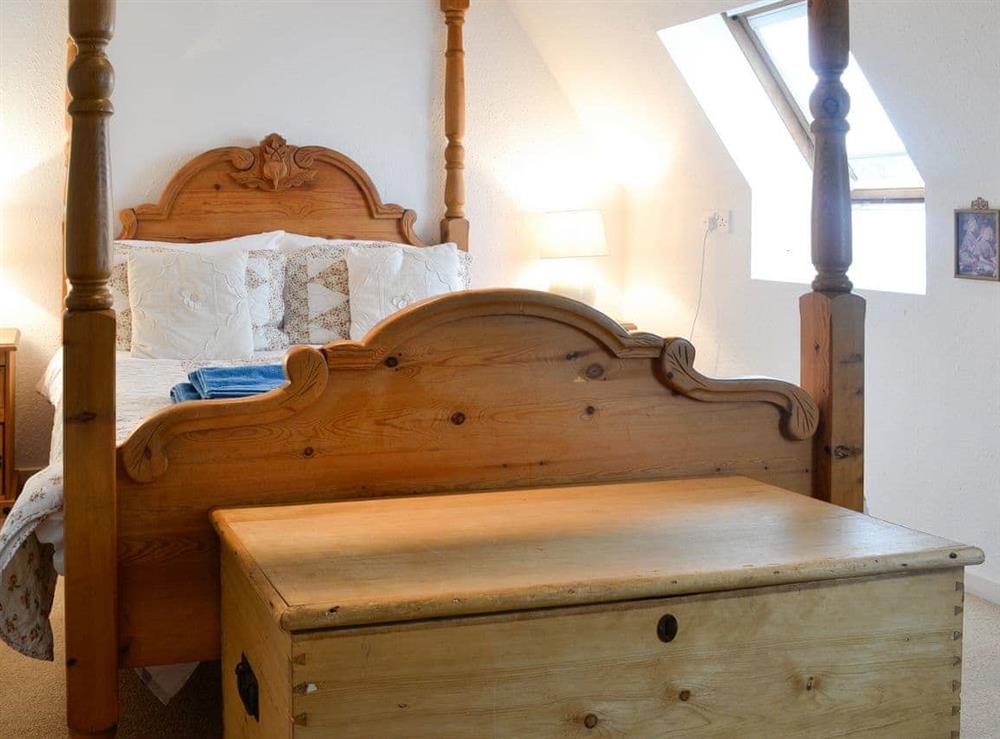 Elegant four poster bed at Holly Cottage in Colvend, near Rockcliffe, Kirkcudbrightshire