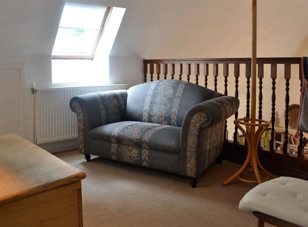 Mazzanine floor with comfy sofa at Holly Cottage in Colvend, near Rockcliffe, Kirkcudbrightshire