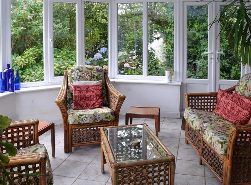 Wonderful and bright conservatory with garden access at Holly Cottage in Colvend, near Rockcliffe, Kirkcudbrightshire