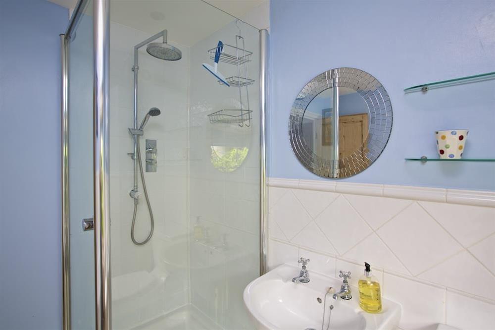 Family bathroom with bath and separate shower at Holly Cottage in Devon Road, Salcombe