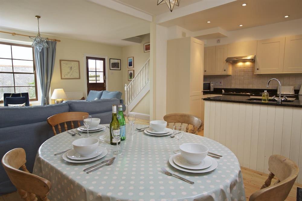 Pine dining table and chairs at Holly Cottage in Devon Road, Salcombe