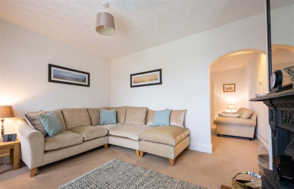 Ground floor: Corner sofa in the sitting room at Holly Cottage, Heacham near Kings Lynn