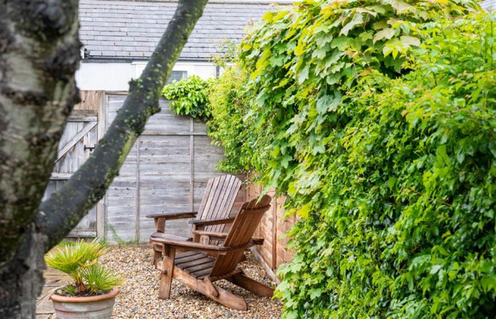 Outside: Rear garden with seating area at Holly Cottage, Heacham near Kings Lynn