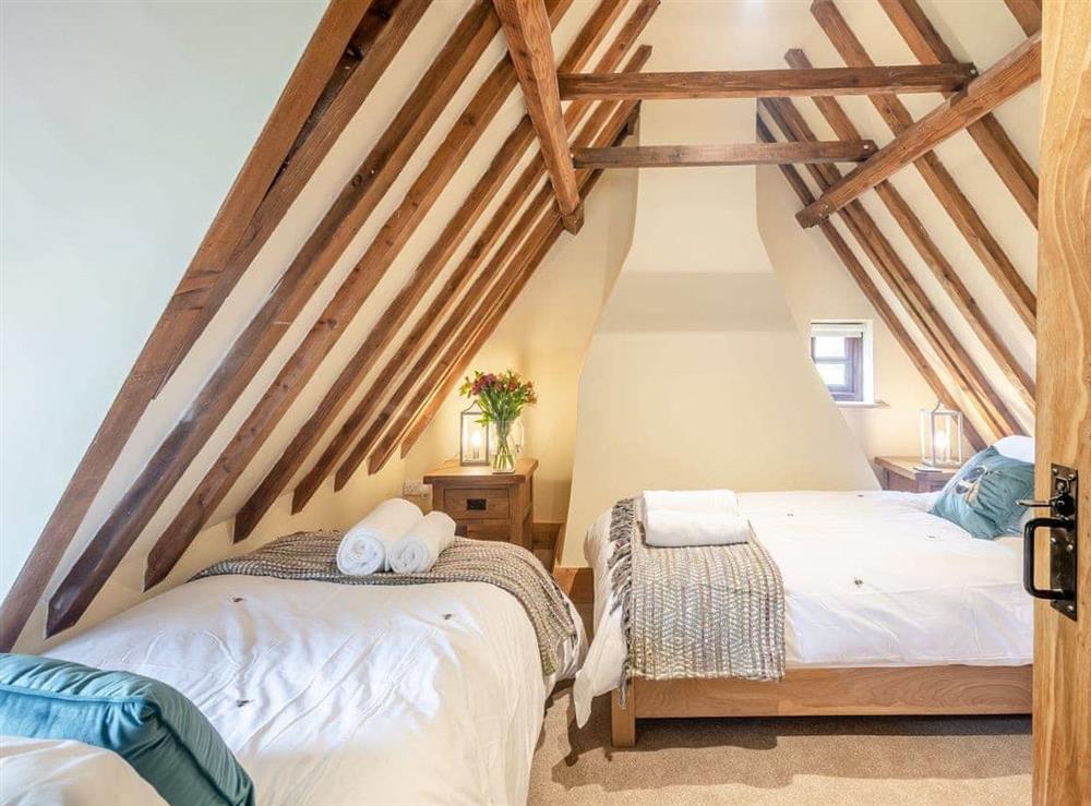Twin bedroom at Holly Cottage in Hemblington, near Norwich, Essex