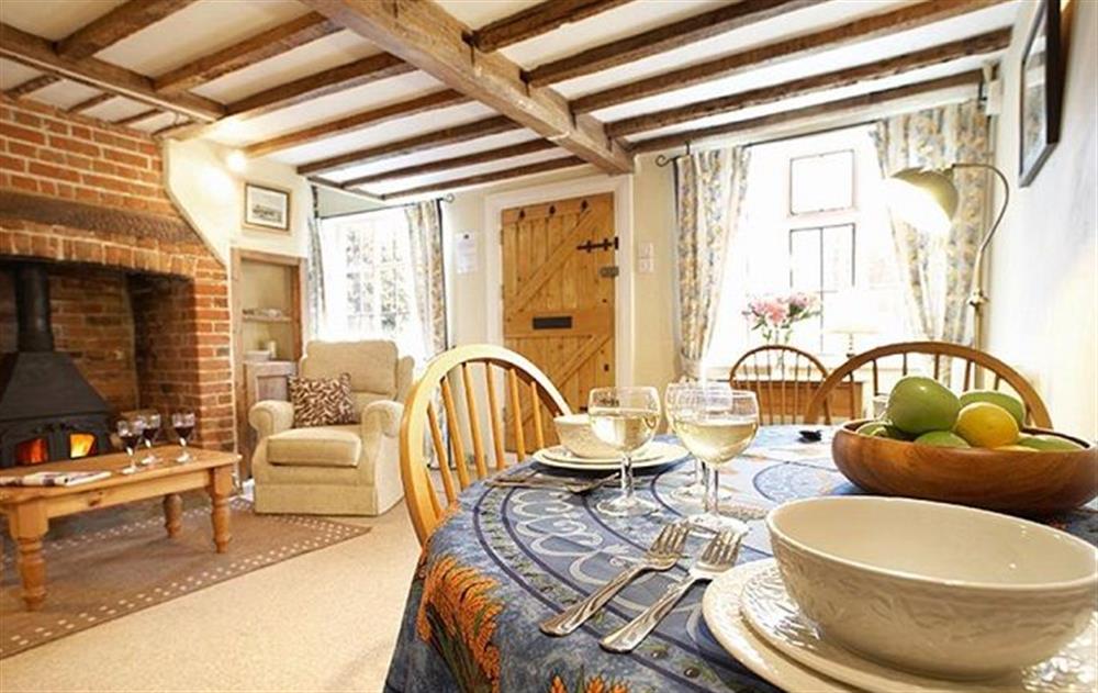 Ground floor: Sitting room with dining area at Holly Cottage, Huntingfield