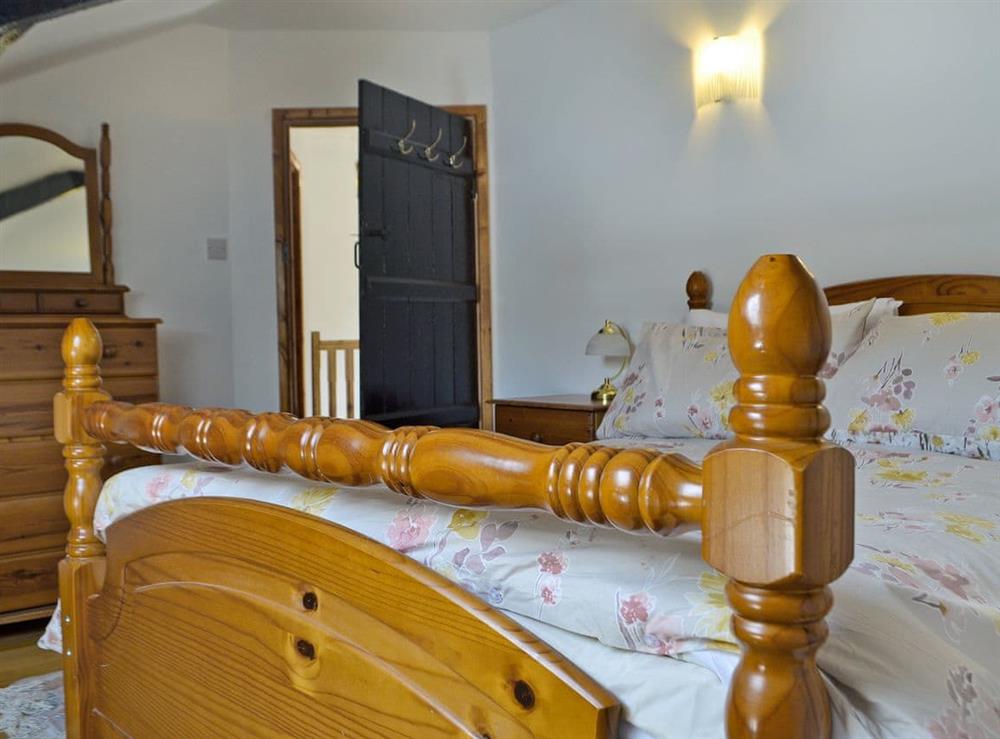 Relaxing double bedroom with kingsize bed (photo 2) at Holly Cottage in Lower Cwmtrch, near Ystradgynlais, Powys