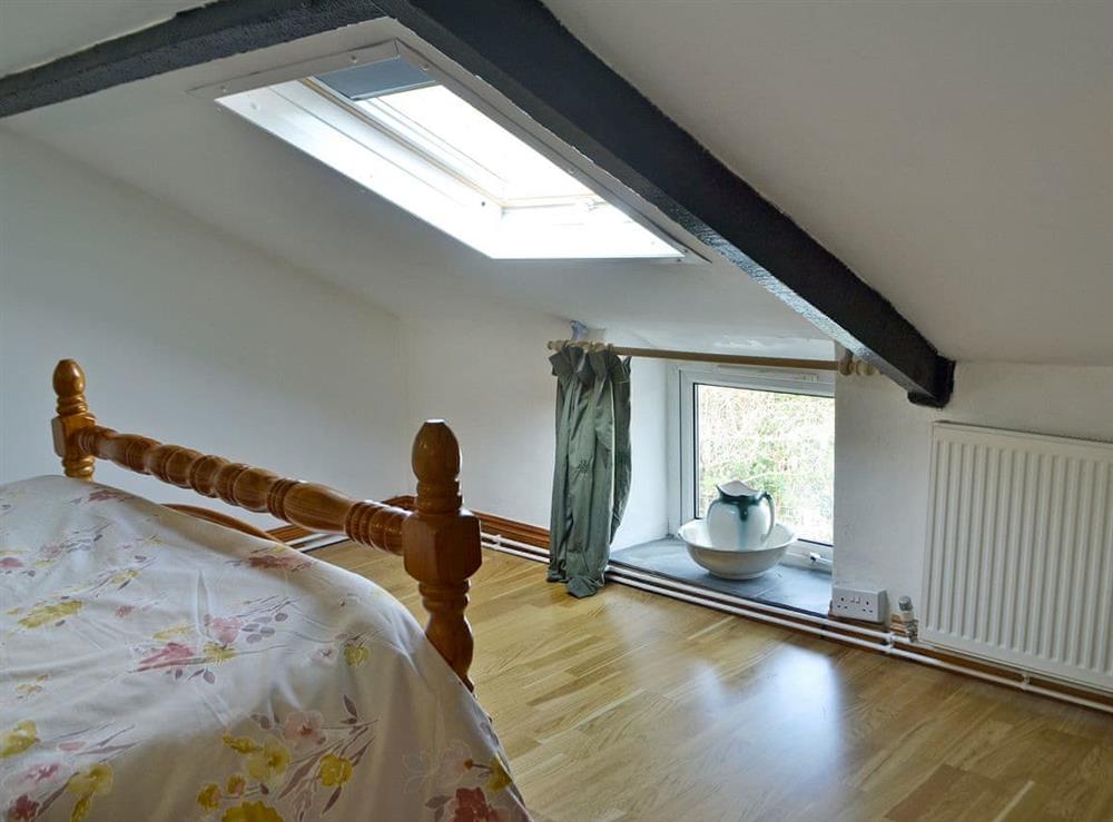 Relaxing double bedroom with kingsize bed (photo 3) at Holly Cottage in Lower Cwmtrch, near Ystradgynlais, Powys