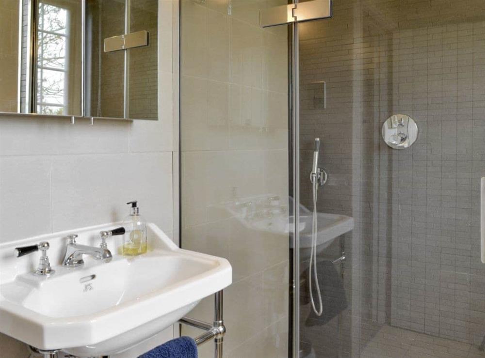 Family bathroom with luxury shower cubicle and separate bath at Holly Cottage in Pett, E. Sussex., East Sussex