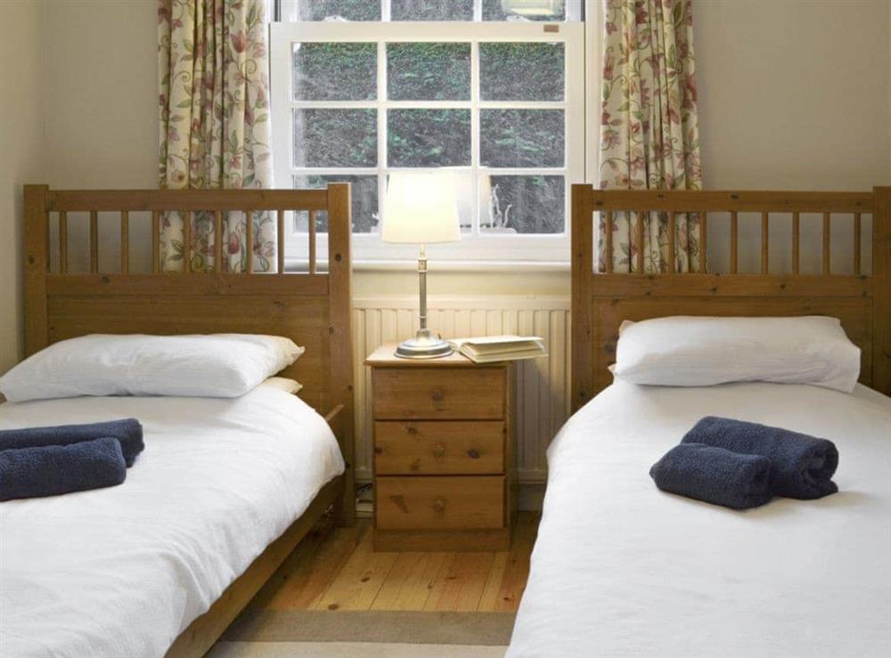 Good-sized twin bedroom at Holly Cottage in Pett, E. Sussex., East Sussex