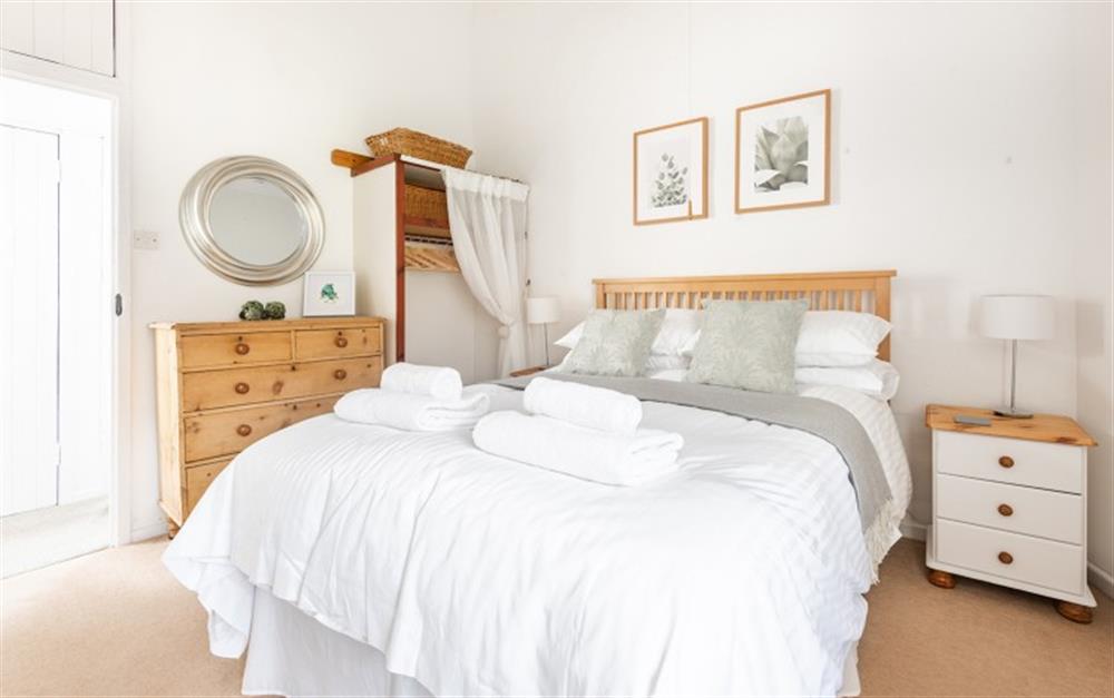 Tasteful master bedroom at Holly Cottage in Slapton