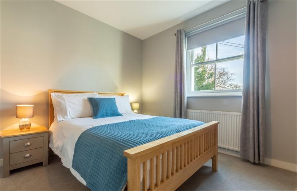 First floor: The master bedroom has double bed at Holly Lodge, Wells-next-the-Sea