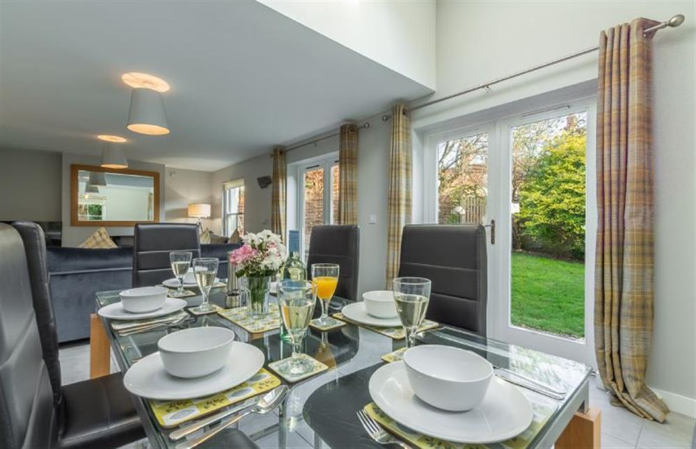 Ground floor: The dining area has french doors into the garden at Holly Lodge, Wells-next-the-Sea