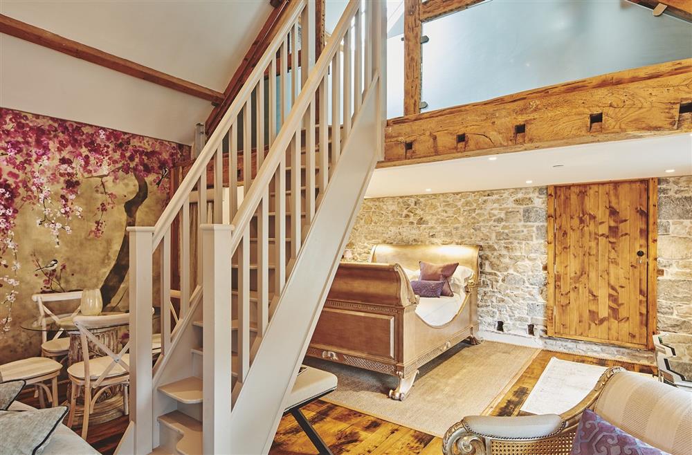 The staircase to the mezzanine level and king-size bed