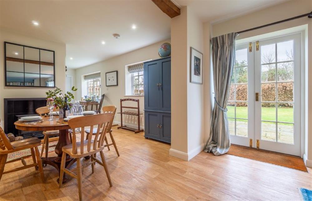 Dining area with dining table and seating for up to four guests at Hollyhock Cottage, Stoke By Nayland