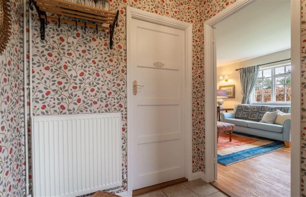 Hallway with views to the sitting room at Hollyhock Cottage, Stoke By Nayland