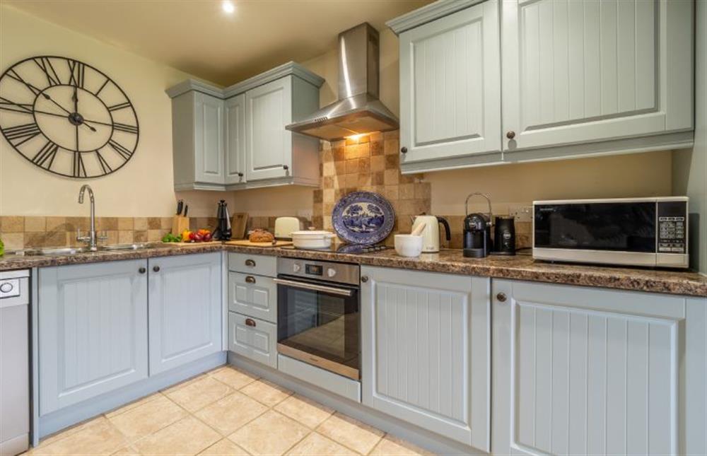 Well-equipped kitchen with electric oven and hob at Hollyhock Cottage, Stoke By Nayland