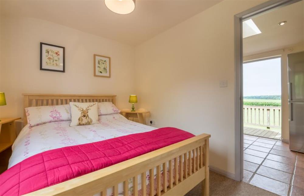 Ground floor: Master bedroom with double bed (photo 2) at Hollyhock, Houghton near Kings Lynn