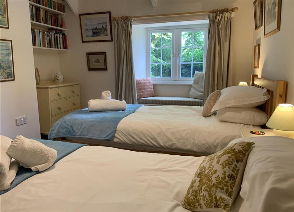 Twin bedroom at Hollyhocks Cottage in Hellandbridge