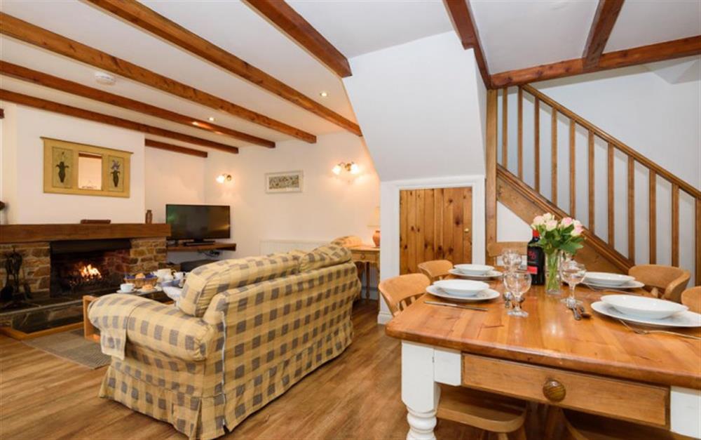 Attractive lounge with open fire at Holm Oak Cottage in Looe