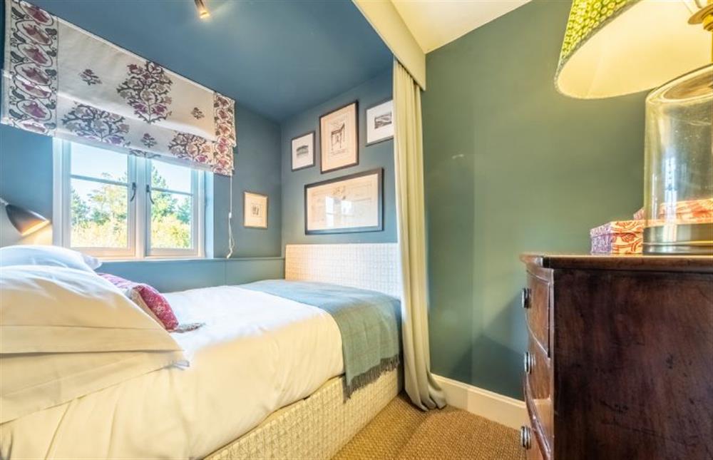 Bedroom six is a stylish cosy room with small double bed at Holmbush, Thornham near Hunstanton