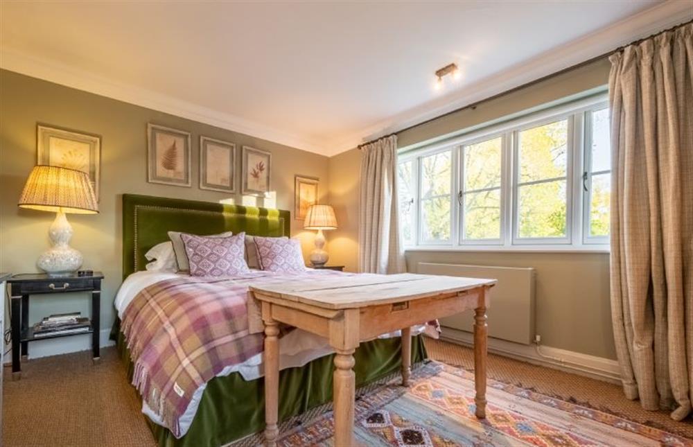Bedroom two has a king-size bed at Holmbush, Thornham near Hunstanton
