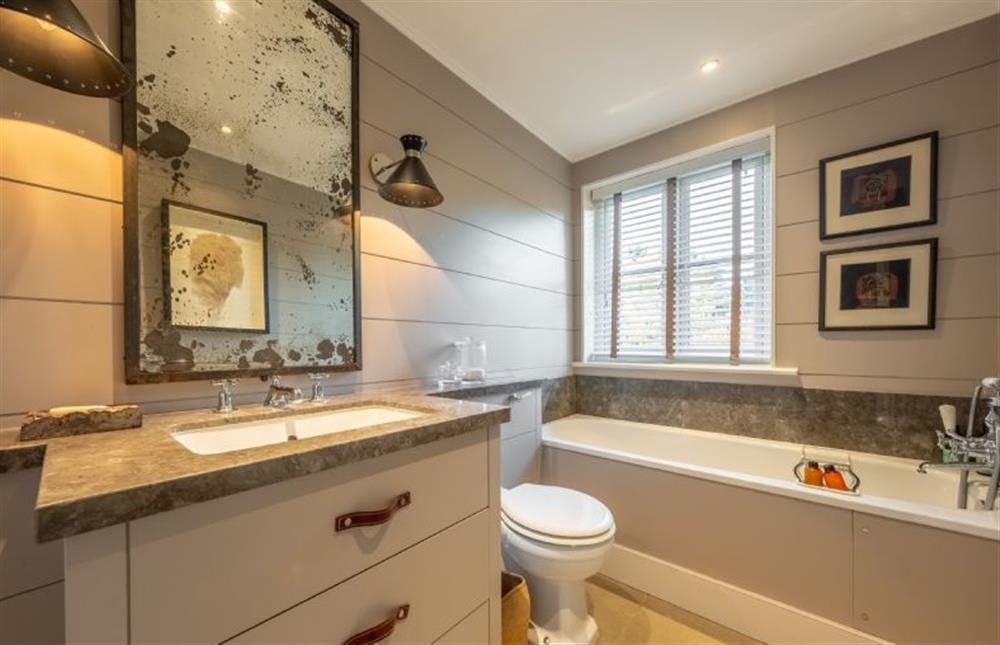The family bathroom with bath and hand-held shower at Holmbush, Thornham near Hunstanton