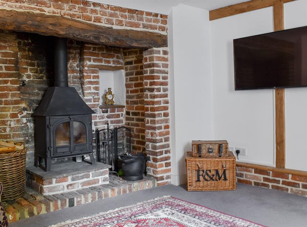 Comfortable living room with wood burner at Holme Cottage in Eastry, near Sandwich, Kent