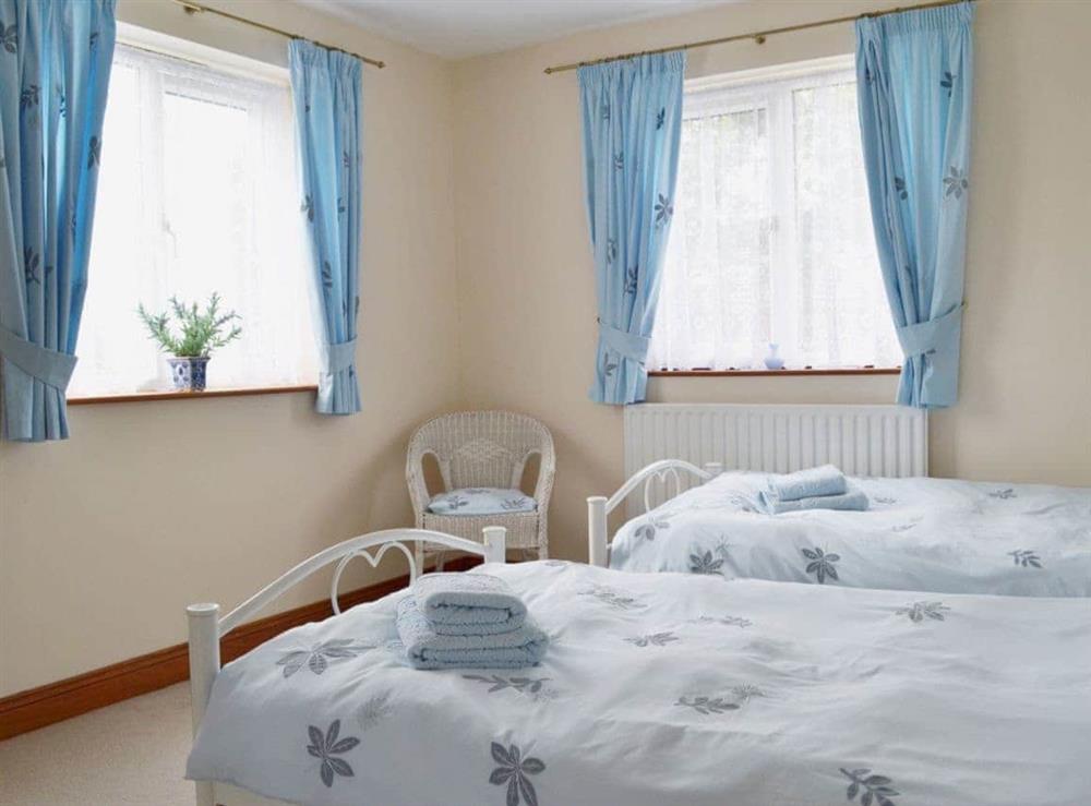 Twin bedroom with double-aspect windows at Holme View in Clifton, near Ashbourne, Derbyshire