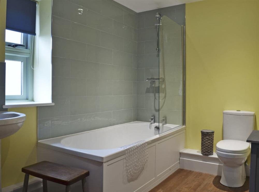 Bathroom with shower over bath at Wagtail Cottage, 