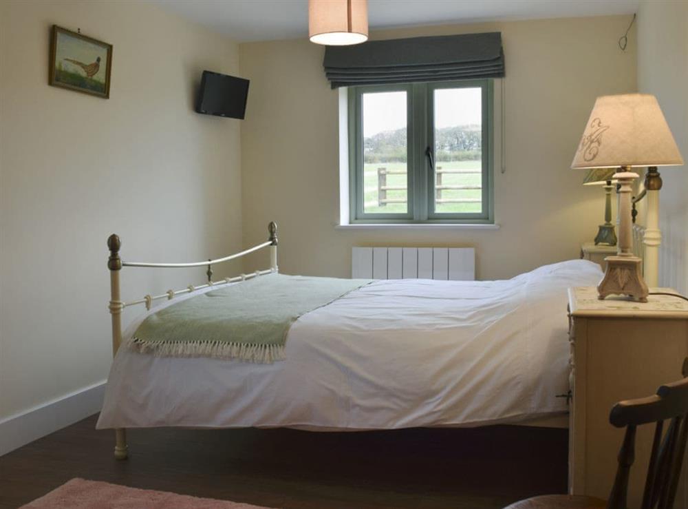 Elegantly decorated double bedroom at Wagtail Cottage, 