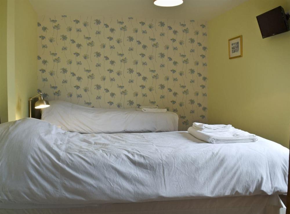 Cosy twin bedroom at Waxwing Cottage, 