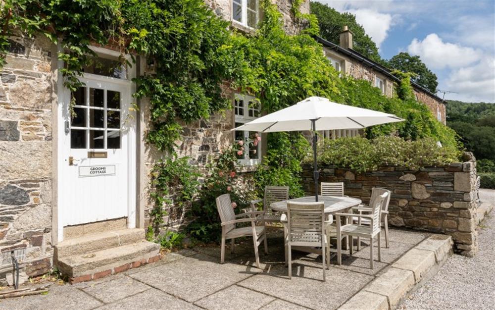 Enjoy some alfresco dining on the terrace to the front of the cottage. at Holne Chase Grooms Cottage in Ashburton