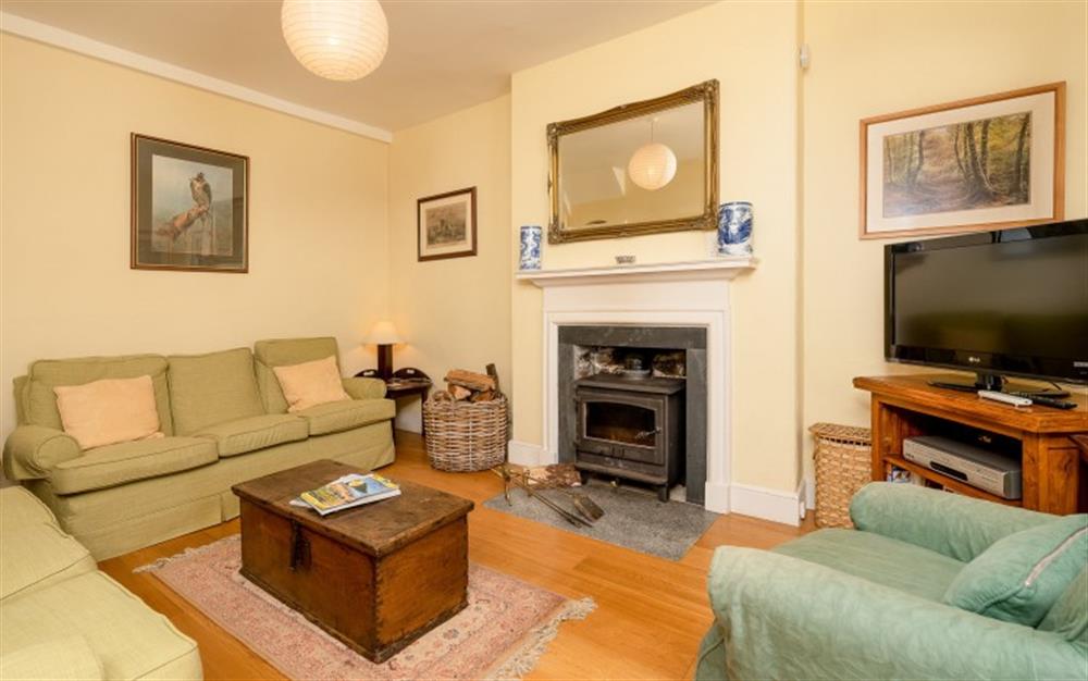 The cosy sitting room with wood-burner. at Holne Chase Grooms Cottage in Ashburton