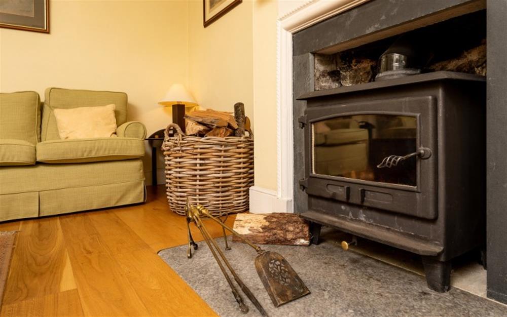 The wood-burning stove, perfect for warming up after a winter Dartmoor Walk at Holne Chase Grooms Cottage in Ashburton