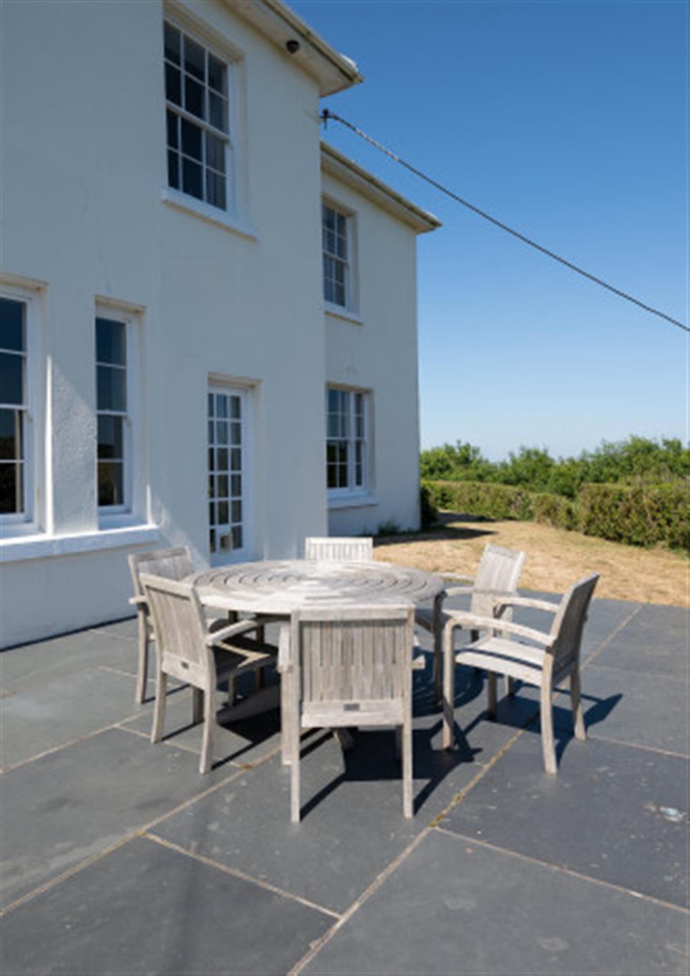 The large terrace outside of the lounge and kitchen windows. at Holset House in East Portlemouth
