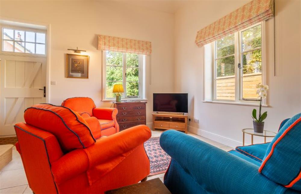 Enjoy the tranquil surroundings from the sitting area at Holt Coach House, Sudbury