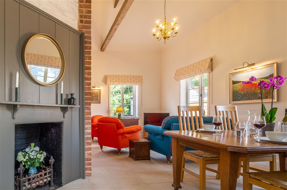 Open-plan sitting/dining room at Holt Coach House, Sudbury
